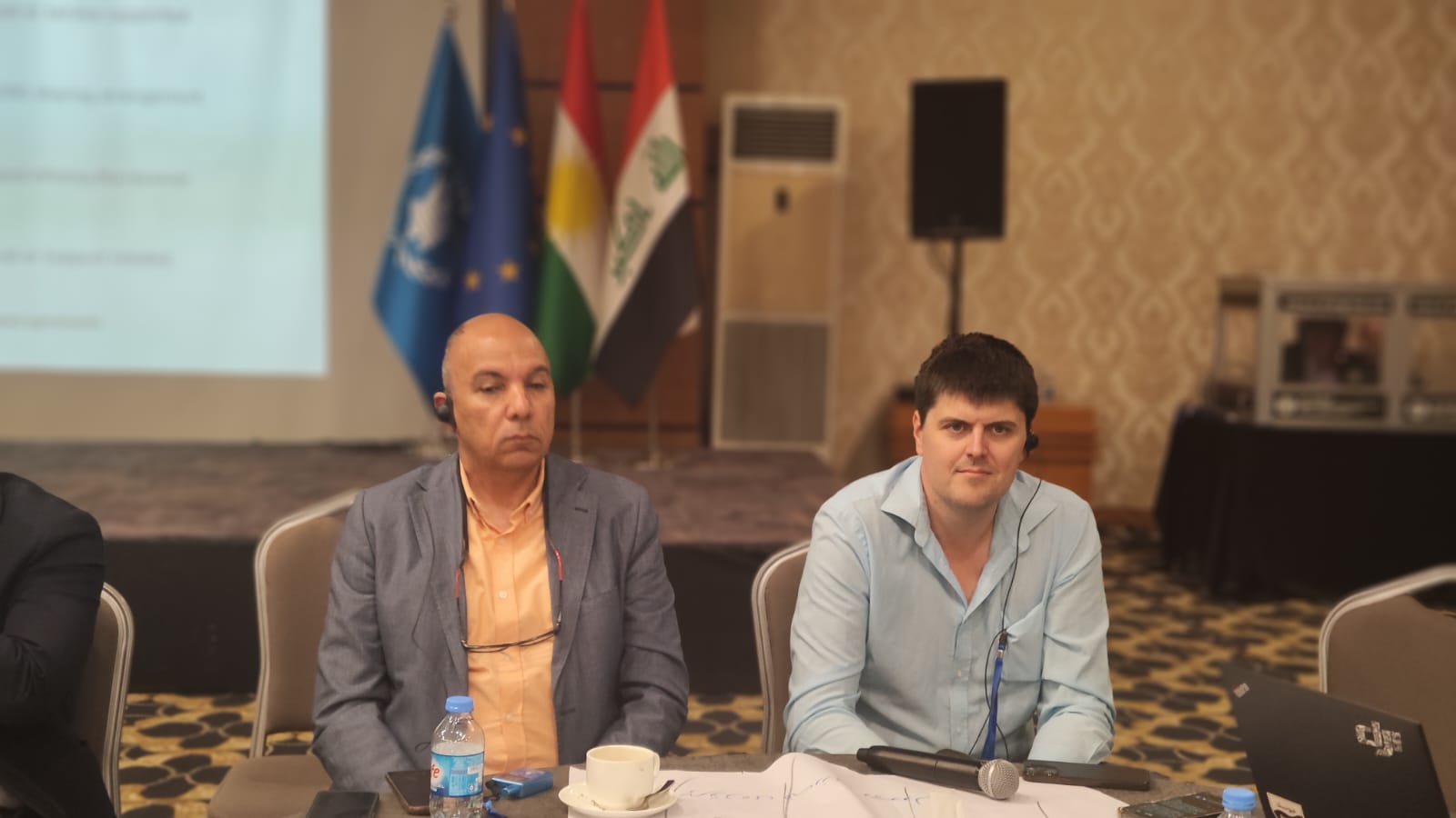 Workshop colleagues during a table discussion in Erbil