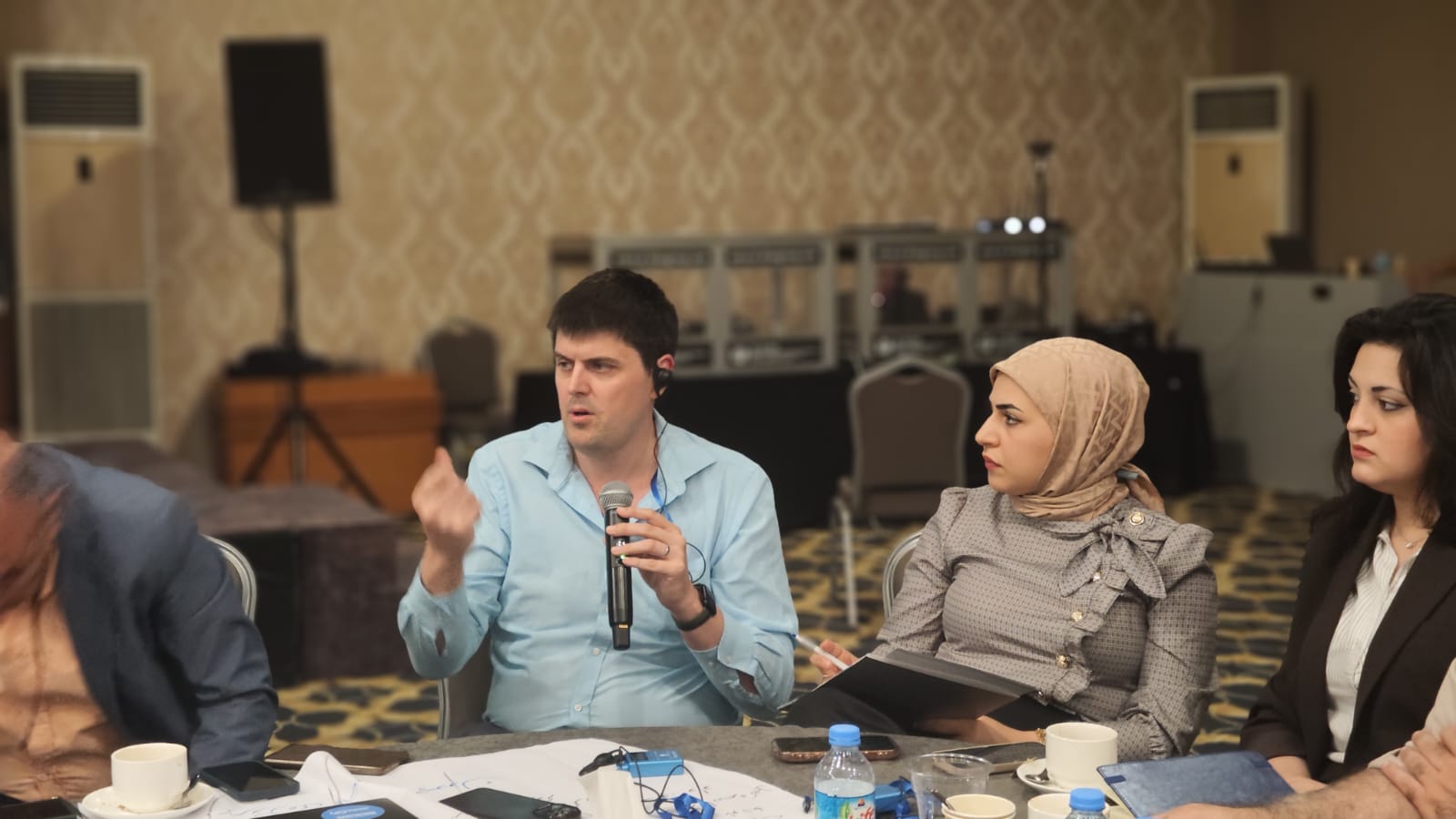 Thomas Byrnes contributing to a table discussion with workshop colleagues